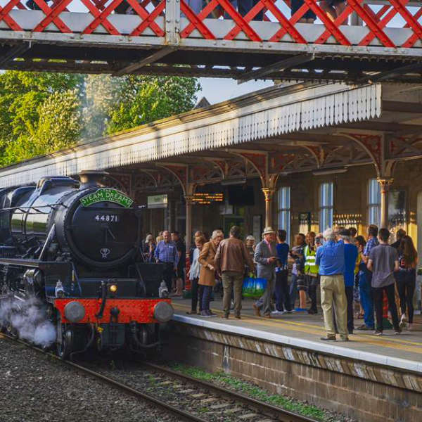 Steam train arriving at Kemble train station